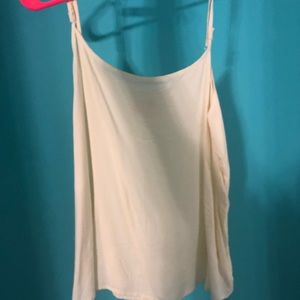 Cream colored tank top. Never worn